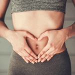 Woman touching her tummy