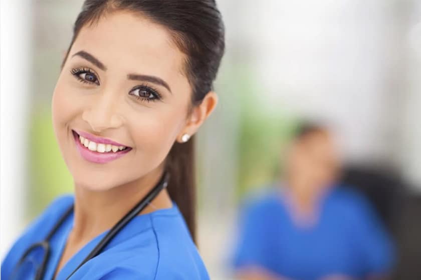 Woman in blue scrubs